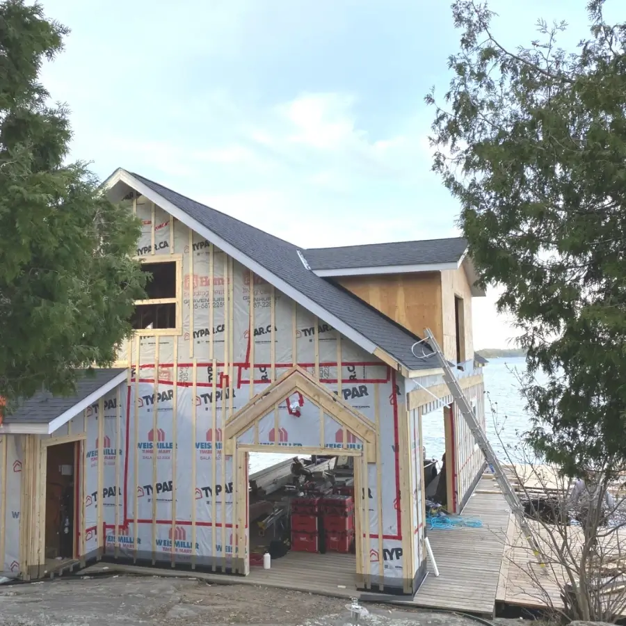 Bracebridge 6 New roof installation on a lakefront home under construction in bracebridge Ontario